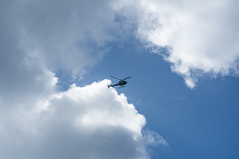 low angle shot helicopter cloudy sky